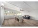 Bright living room with hardwood floors, white walls and multiple windows at 3632 E Poinsettia Dr, Phoenix, AZ 85028