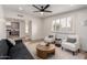 Bright living room with large window, modern furnishings, and open floor plan at 3632 E Poinsettia Dr, Phoenix, AZ 85028