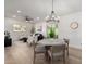 Open concept living room and dining area features modern furnishings, neutral tones, and bright natural light at 3632 E Poinsettia Dr, Phoenix, AZ 85028