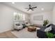 Modern living room with neutral colors, a ceiling fan, and stylish furniture at 3632 E Poinsettia Dr, Phoenix, AZ 85028