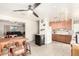 Efficient kitchen with modern appliances, wood-look laminate flooring, and dining area at 3736 W Hazelwood St, Phoenix, AZ 85019
