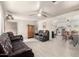 Comfortable living room featuring leather reclining sofas and ceiling fan at 3736 W Hazelwood St, Phoenix, AZ 85019