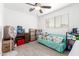An organized storage area featuring a bright airy space with ample shelving, and organized containers on a sofa at 3736 W Hazelwood St, Phoenix, AZ 85019