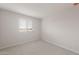 Comfortable bedroom with ample natural light and neutral carpeting at 4107 S 176Th Dr, Goodyear, AZ 85338