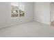 Cozy bedroom featuring plush carpeting, a bright window, and a convenient closet at 4107 S 176Th Dr, Goodyear, AZ 85338