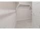 Walk-in closet featuring shelving, rod, and carpet, providing ample storage at 4107 S 176Th Dr, Goodyear, AZ 85338