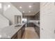 Open kitchen with stainless steel appliances, granite countertops, and eat-in bar at 4107 S 176Th Dr, Goodyear, AZ 85338