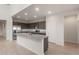 Bright, spacious kitchen with stainless steel appliances and a large center island at 4107 S 176Th Dr, Goodyear, AZ 85338