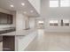 Bright open floor plan with modern kitchen featuring granite counters and recessed lighting at 4107 S 176Th Dr, Goodyear, AZ 85338
