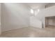 Bright, large living room with high ceilings, light tile floors, and modern design at 4107 S 176Th Dr, Goodyear, AZ 85338