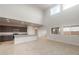 Bright and airy living space boasting high ceilings, large windows, and an adjacent modern kitchen at 4107 S 176Th Dr, Goodyear, AZ 85338