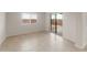 Modern living room with sliding doors to the backyard, plenty of natural light at 4107 S 176Th Dr, Goodyear, AZ 85338