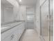 Bathroom with double vanity, quartz countertops, and a glass-enclosed shower, offering a spa-like experience at 4113 S 176Th Dr, Goodyear, AZ 85338