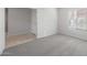An empty bedroom features neutral walls, carpet flooring, and a large window for natural light at 4113 S 176Th Dr, Goodyear, AZ 85338