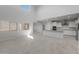 Open-concept kitchen with white cabinetry, stainless steel appliances, and bright neutral paint at 4113 S 176Th Dr, Goodyear, AZ 85338