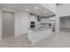 Kitchen boasts large island, stainless steel appliances, and plenty of white cabinetry at 4113 S 176Th Dr, Goodyear, AZ 85338