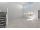 Bright living space features neutral paint, tile floors, and staircase at 4113 S 176Th Dr, Goodyear, AZ 85338