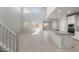 Open-concept living space boasts soaring ceilings, large windows, and a stylish kitchen at 4113 S 176Th Dr, Goodyear, AZ 85338