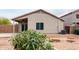 View of the backyard featuring desert landscaping and a covered patio space at 41580 W Sunland Dr, Maricopa, AZ 85138