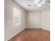 Bright bedroom with wood floors and a ceiling fan at 41580 W Sunland Dr, Maricopa, AZ 85138