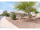 Attractive single-story home displaying desert landscaping and privacy on a corner lot at 41580 W Sunland Dr, Maricopa, AZ 85138