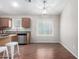 Bright kitchen with stainless steel appliances, ample counter space, and eat-in dining area at 41580 W Sunland Dr, Maricopa, AZ 85138