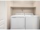 Laundry room featuring side-by-side white washer and dryer at 41580 W Sunland Dr, Maricopa, AZ 85138