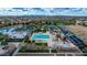 Aerial view of the community pool and park with lake in the background at 4364 S Tatum Ln, Gilbert, AZ 85297