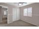 Bedroom featuring a neutral color palette, window with blinds, and closet with sliding doors at 4364 S Tatum Ln, Gilbert, AZ 85297