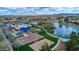 Aerial view of community park featuring a playground, basketball court, volleyball court, lake and walking path at 4364 S Tatum Ln, Gilbert, AZ 85297