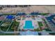 Aerial view of a large community pool with seating areas, landscaping, and shaded areas at 4364 S Tatum Ln, Gilbert, AZ 85297