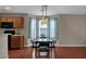 Open dining room with light fixture, view of kitchen, and natural light at 4364 S Tatum Ln, Gilbert, AZ 85297