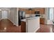 Kitchen boasting light countertops and wooden cabinets, with an island and black appliances at 4364 S Tatum Ln, Gilbert, AZ 85297