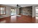 Living room showcasing wood floors, wall feature, and sliding glass door at 4364 S Tatum Ln, Gilbert, AZ 85297