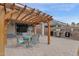 Backyard boasts an outdoor kitchen, a pergola, and a brick patio perfect for entertaining guests outdoors at 4364 S Tatum Ln, Gilbert, AZ 85297