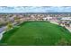 Expansive green community soccer field surrounded by lush landscaping and neighborhood homes at 4364 S Tatum Ln, Gilbert, AZ 85297