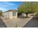 Low-maintenance backyard featuring gravel, desert landscaping, and a view of the home's exterior at 4417 N 156Th Dr, Goodyear, AZ 85395