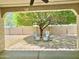 Inviting backyard featuring a mature shade tree and seating, perfect for relaxing outdoors at 4417 N 156Th Dr, Goodyear, AZ 85395