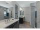 Bathroom features double sinks, tiled walls, and shower stall with built-in shelves at 4417 N 156Th Dr, Goodyear, AZ 85395