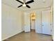 Bedroom with tile floors and ceiling fan, and closet at 4417 N 156Th Dr, Goodyear, AZ 85395