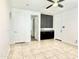 Versatile bonus room with gray cabinets, tile floor, and access to other areas at 4417 N 156Th Dr, Goodyear, AZ 85395