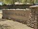 Entrance sign for the 'Palmetto Passage' community, with stacked stone accents and landscaping at 4417 N 156Th Dr, Goodyear, AZ 85395