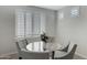 Cozy dining area with a glass table, comfortable chairs, and bright natural light at 4417 N 156Th Dr, Goodyear, AZ 85395