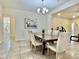Elegant dining room with chandelier, modern furnishings, and views of the living spaces at 4417 N 156Th Dr, Goodyear, AZ 85395