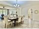 Inviting dining space featuring a large wooden table, six chairs, and views to other living areas at 4417 N 156Th Dr, Goodyear, AZ 85395