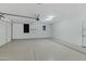 Spacious garage featuring a sealed floor, overhead storage, and ample space for vehicles at 4417 N 156Th Dr, Goodyear, AZ 85395