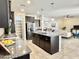 Well-equipped kitchen with granite counters, stainless appliances, island, and open layout at 4417 N 156Th Dr, Goodyear, AZ 85395