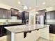 Beautiful kitchen boasts granite counters, stainless steel appliances, ample cabinet space, and a functional island at 4417 N 156Th Dr, Goodyear, AZ 85395
