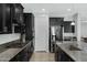 Well-equipped kitchen featuring sleek appliances, granite counters, and ample cabinet space at 4417 N 156Th Dr, Goodyear, AZ 85395
