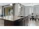 Kitchen island with granite countertop, stainless steel sink, and modern fixtures at 4417 N 156Th Dr, Goodyear, AZ 85395